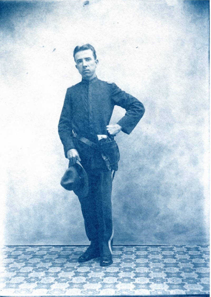 Man in uniform with pistol gun