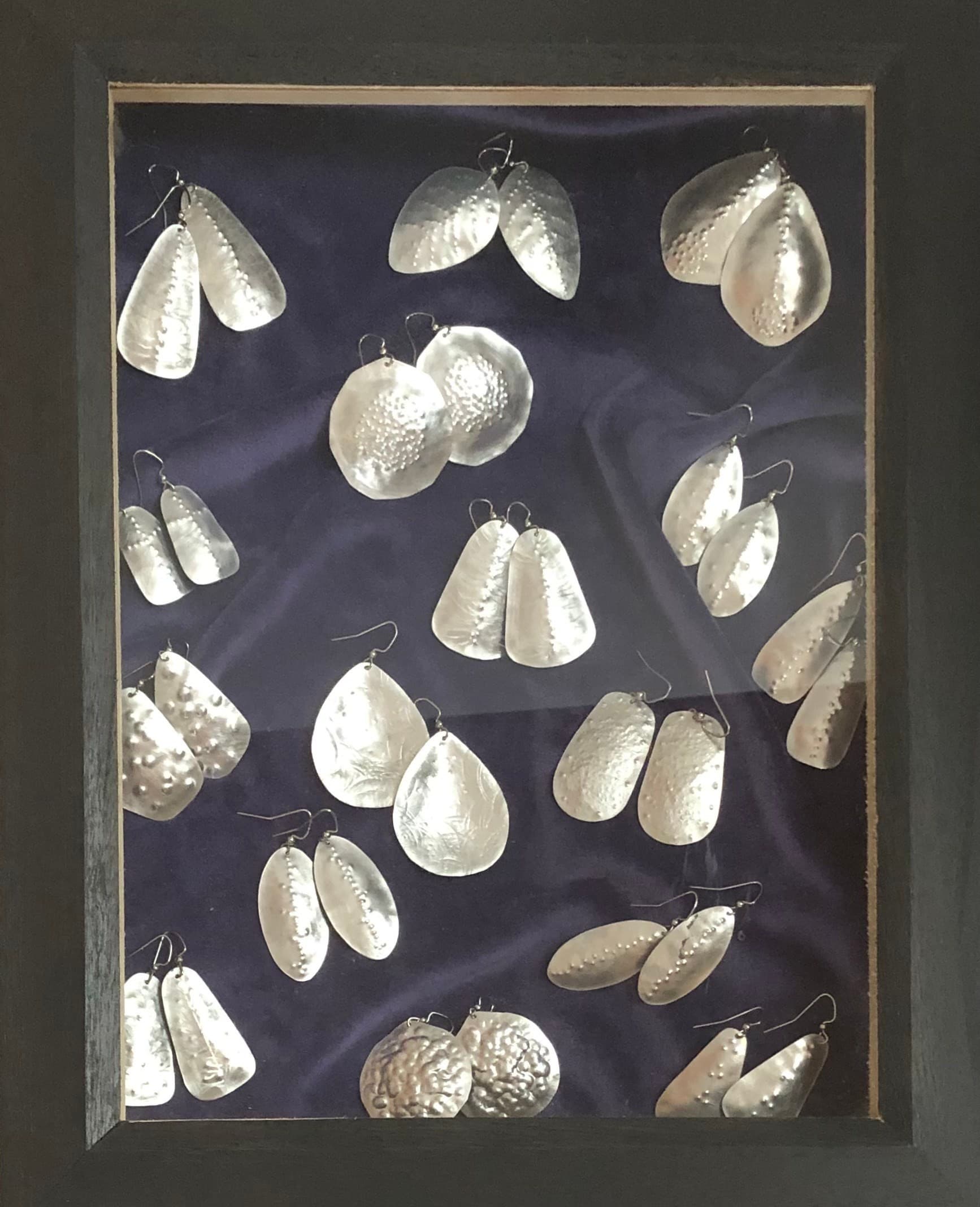 Hand-forged Earrings in Display Case